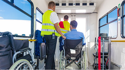 man in wheelchair in the back of a mobility van